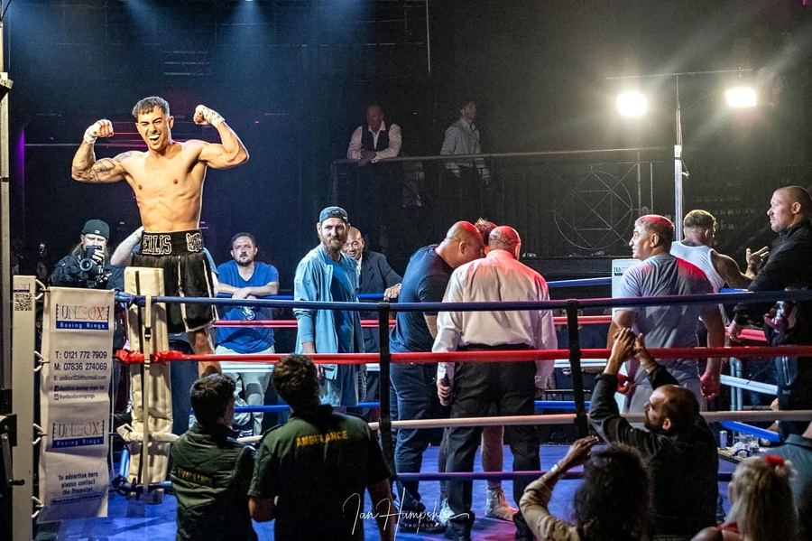 Ellis Harkins celebrating on the ring corner
