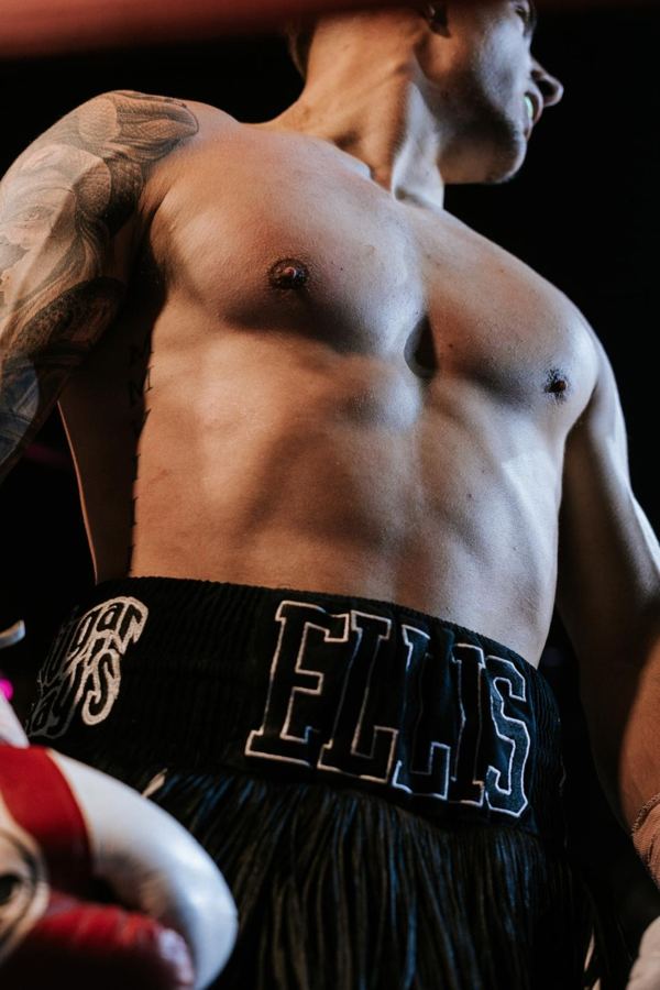 Close-up of Ellis Harkins in his ELLIS fight shorts